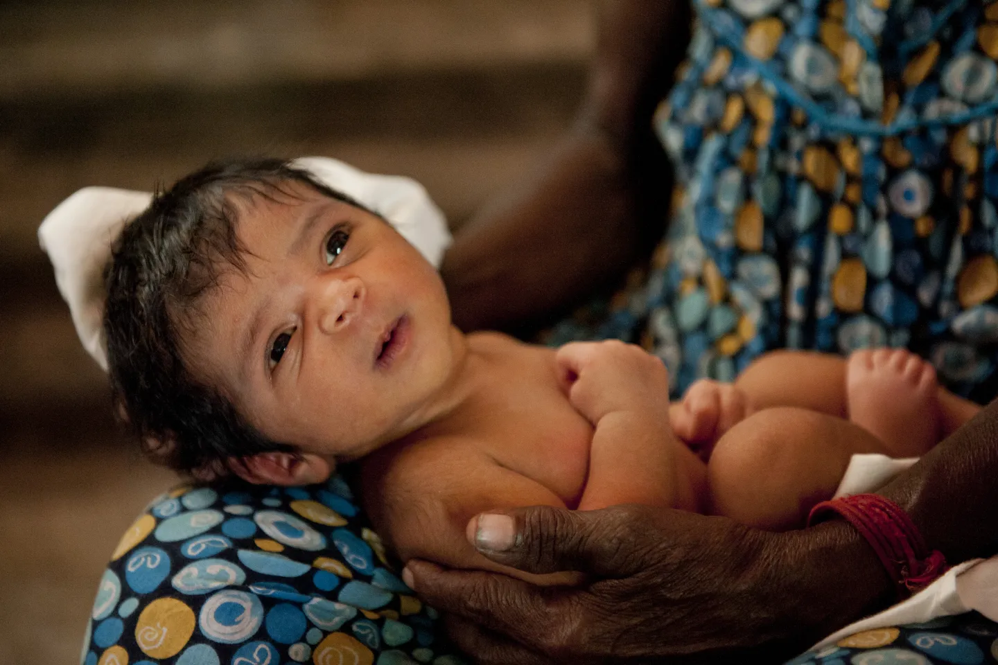 New born baby in mothers arms