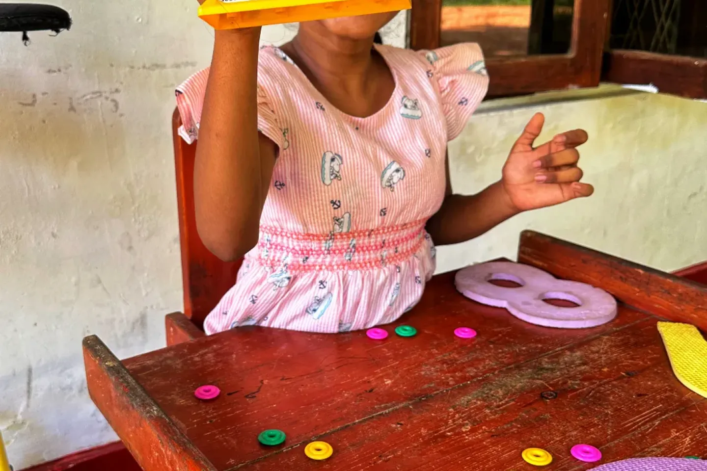 Thyadi's mother Kavini says she notices a clear difference in her daughter's socialization skills after she began visiting the child-friendly space   Thyadi loves maths!   The child-friendly space has become part of Thyadi's recovery