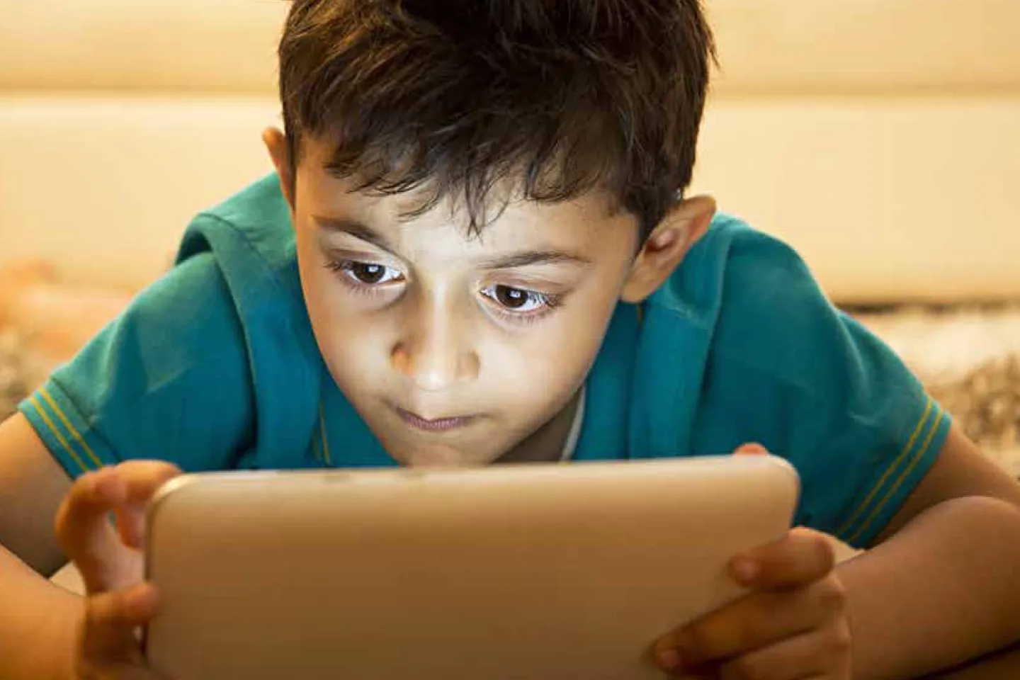 Child with a tablet computer