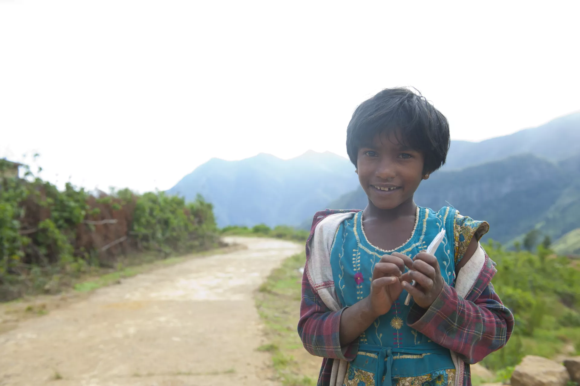 Young girl in a remote village that is hard to access