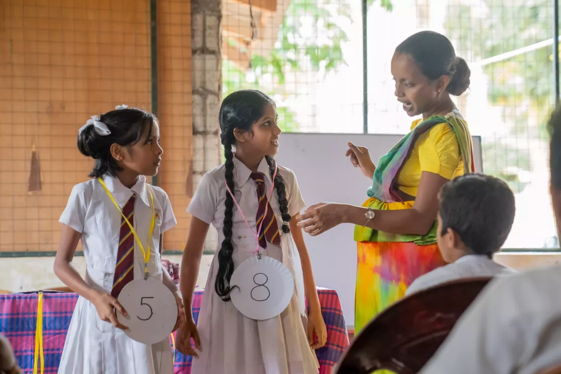 Teacher at Christ Church School conduct activities to introduce numbers to children