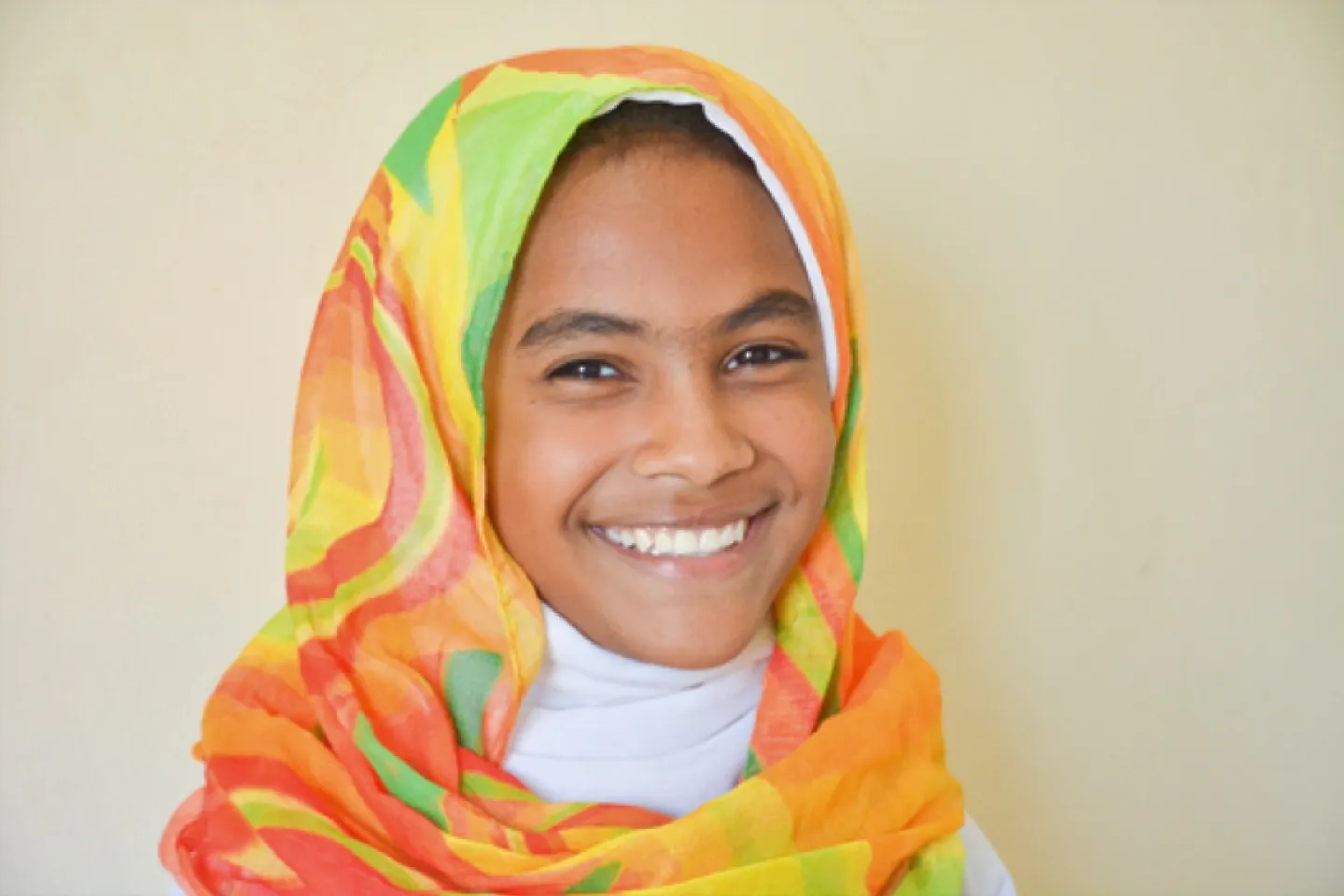 12 year old Reem Mohammed smiles at the camera