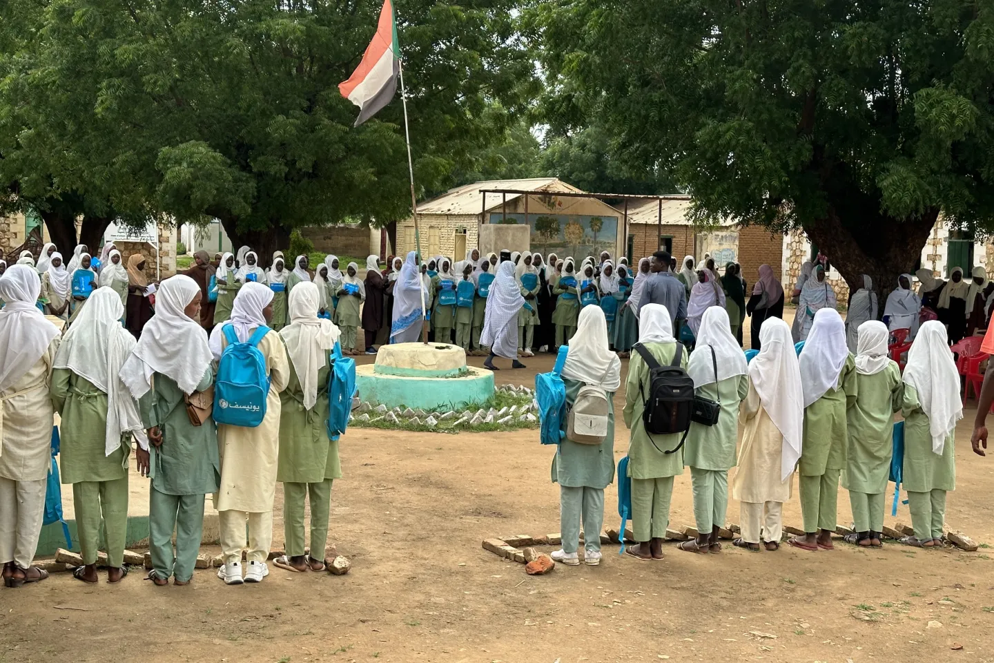 Girls attend morning assembly Almuzuja Girls&rsquo; School in Abujubayha, South Kordofan. UNICEF-supported learning materials, teacher training and classroom rehabilitation are helping children learn.
