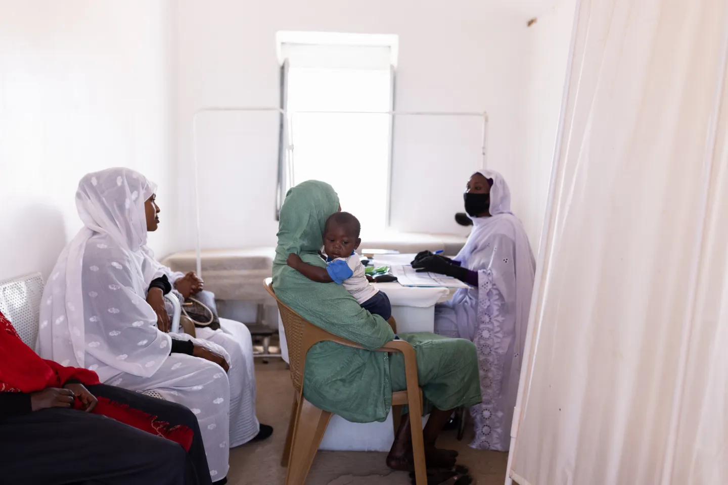 Parents and caregivers access healthcare services at Alwehida Primary Healthcare Centre (PHC) in Sennar State.
