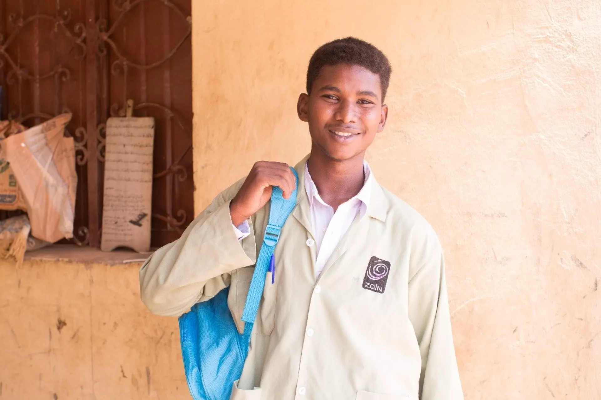 Teenage boy holding a UNICEF backpack
