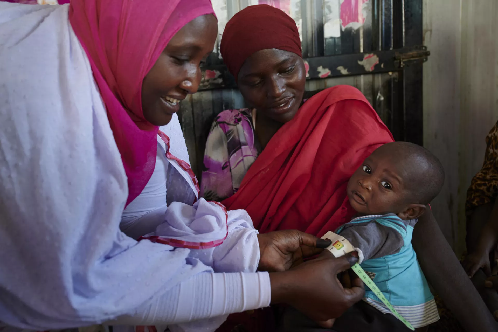 Baby gets measured for malnutrition