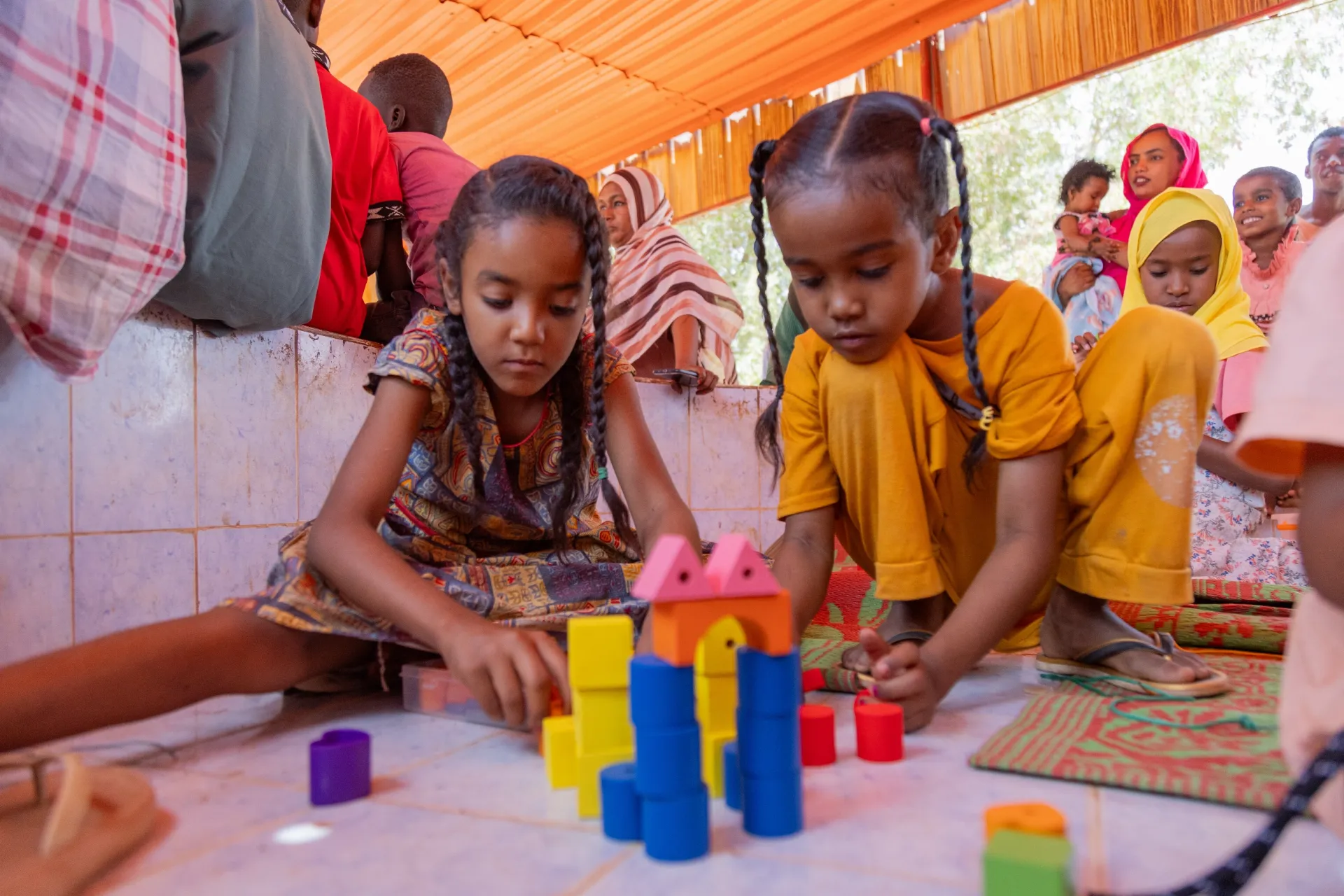 child friendly spaces, CFS, safe environments for children affected by conflict, play, psychosocial support, heal, drawing, Sudan, UNICEF, 