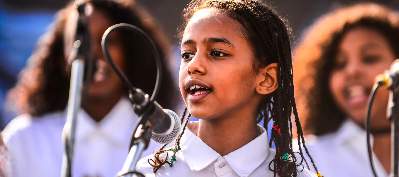 Girl singing into microphone