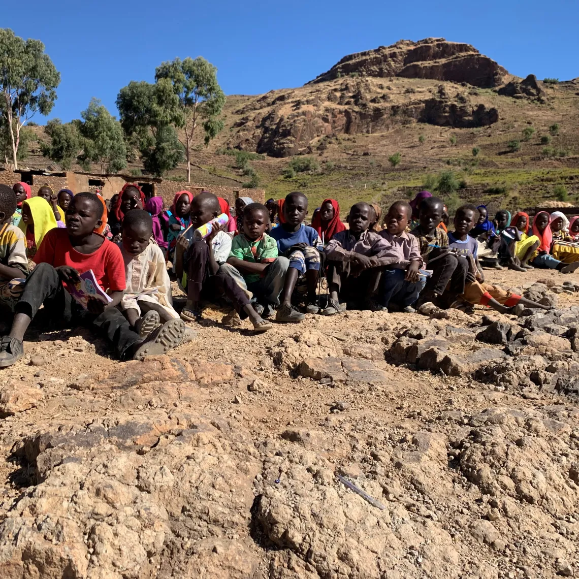 Second grade students in Gorlangbang Elementary School sit outside for their lesson, these students do not have a proper classroom.
