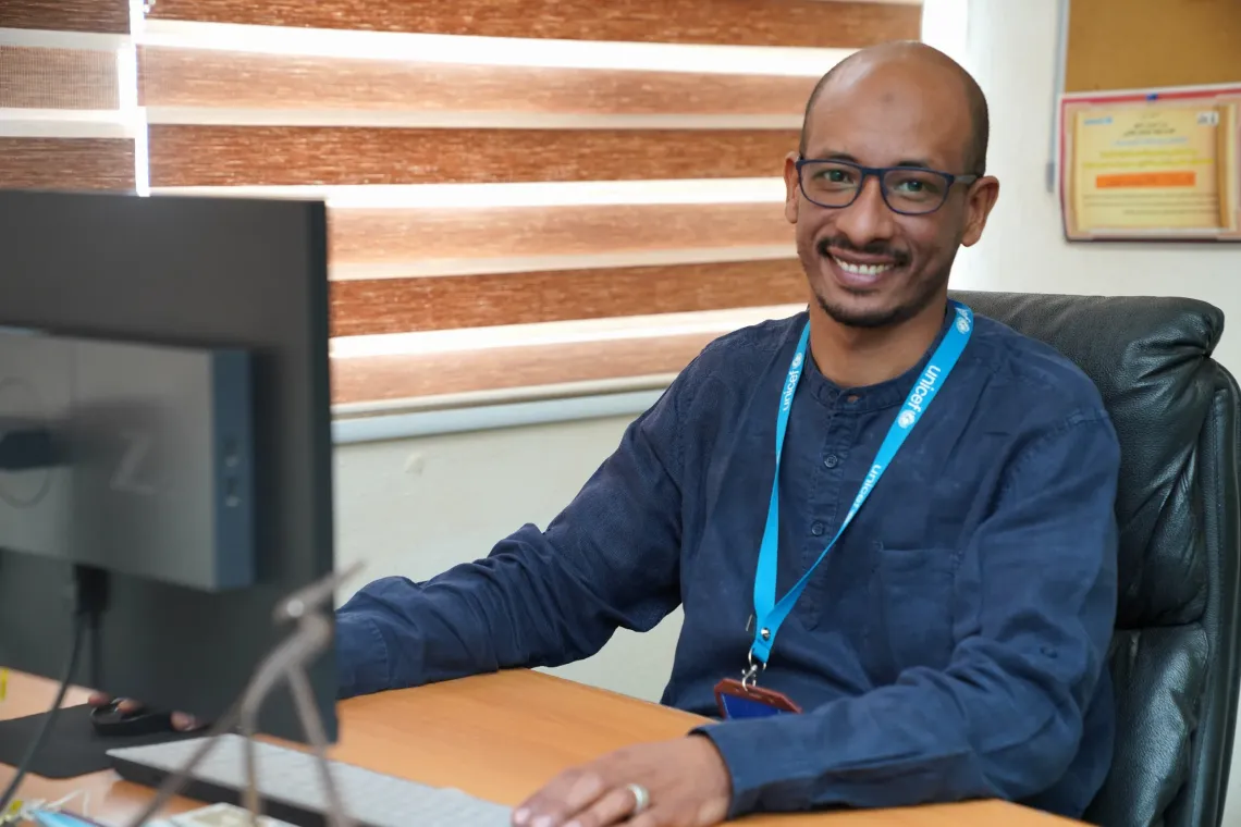 Mahmoud Esmat sitting in an office.