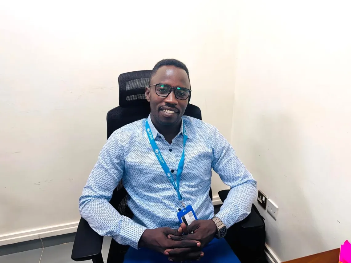 Muhsin Mohamed, UNICEF Project Officer sitting in her office.