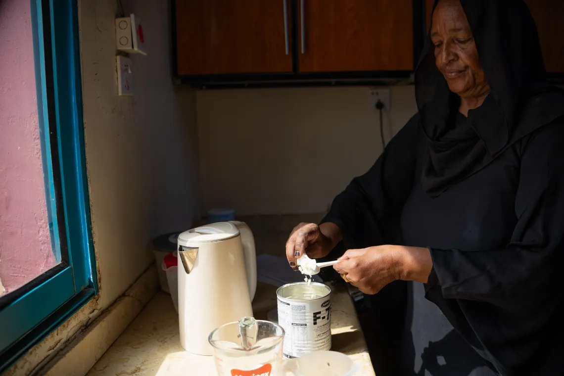 a health worker prepares therapeutic milk for children suffering from severe acute malnutrition and admitted in the stabilization centre in Albuluk hospital, Khartoum State.