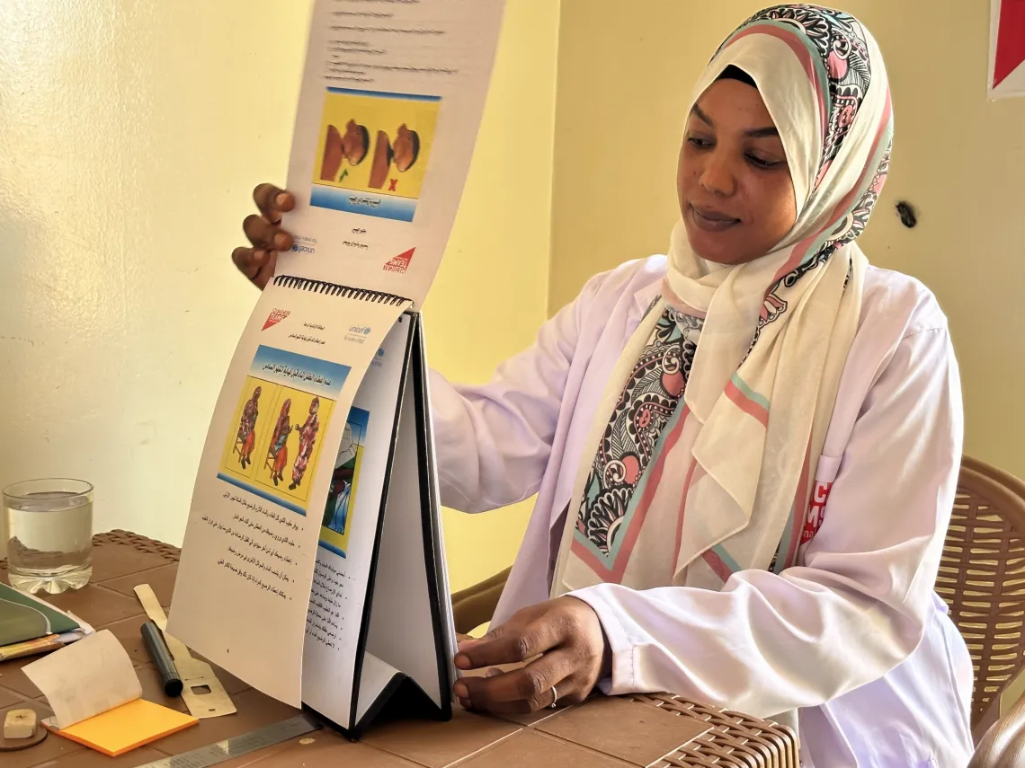 Rayan, a nutrition counsellor prepares to deliver a session on infant feeding at the breastfeeding corner in Bir Hamad Primary Healthcare Centre
