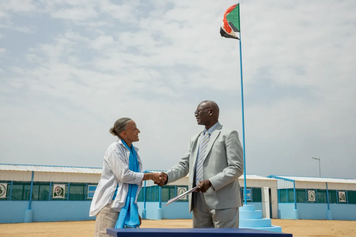 Annmarie Swai, UNICEF Deputy Representative officially hands over the newly constructed Accelerated Learning Programme (ALP) centre to Ismail Ali Adam, the State Ministry of Education, in Goaz Salam internally displaced persons (IDP) Camp in Kosti, White Nile State.