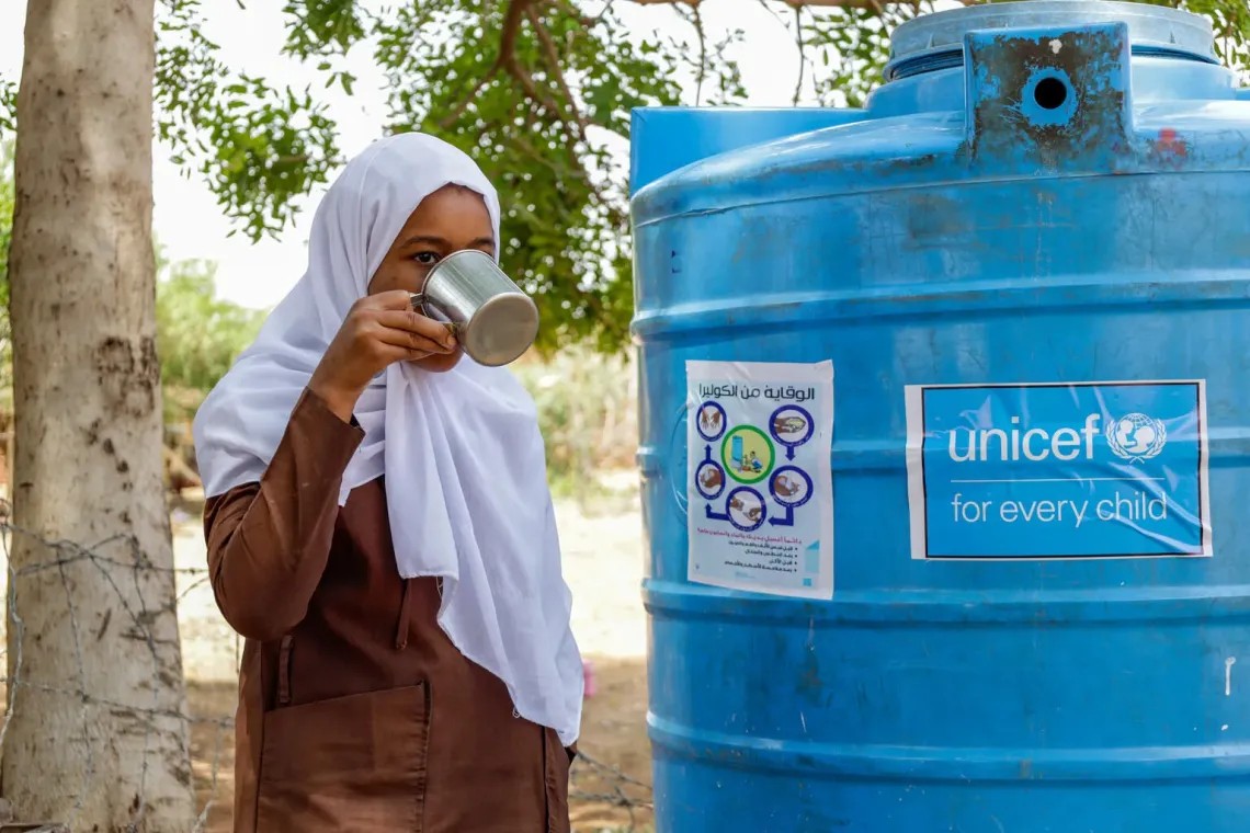 A pupil drinking water at Uhud Basic School in Nyala, South Darfur 
