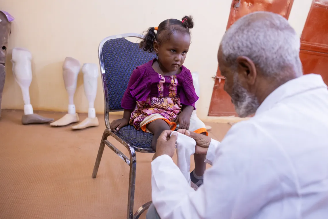 5-year-old Aisha visits the prosthetics centre for rehabilitation services including an artificial limb. 