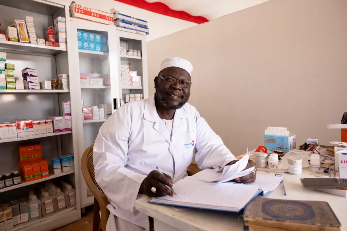 Abdalrahman, a Pharmacist prepares to administer medicines to patients at Alwehida Primary Healthcare Centre (PHC) in Sennar State.