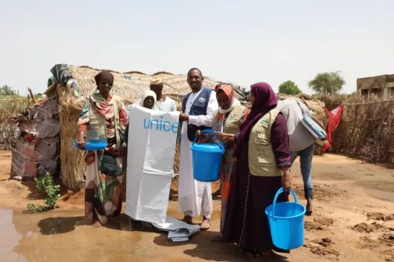 Families affected by the flooding receive relief items from UNICEF partners.