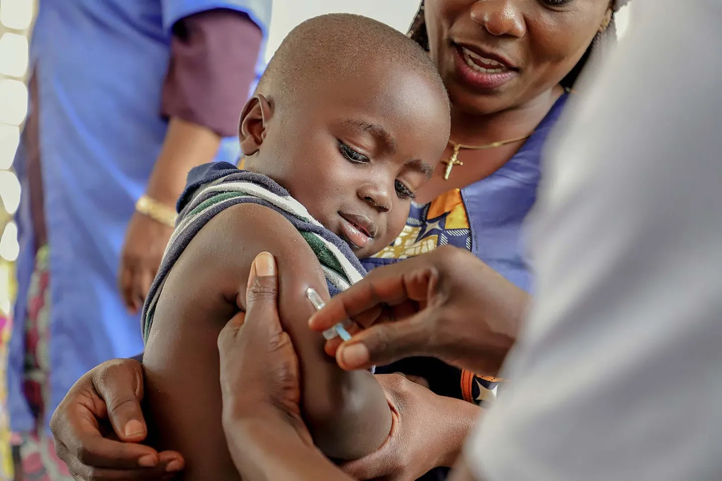 A little boy looks at the syringe while receiving his measles vaccine during the vaccination campaign in Impfondo, Republic of the Congo. 