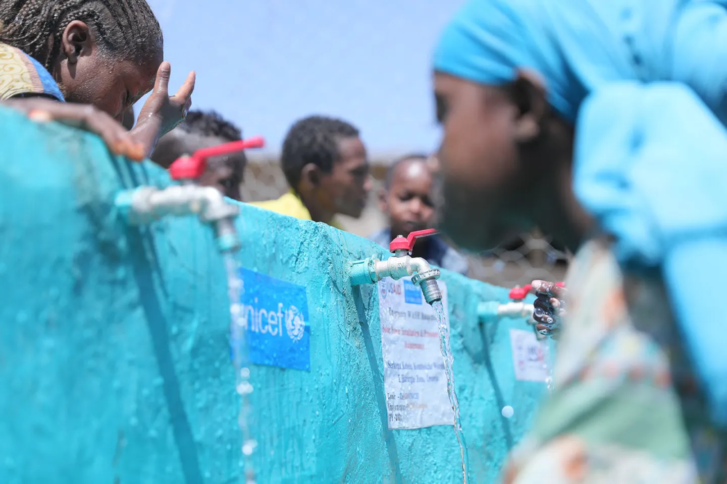 Students drink water and wash their hands at Serkema Primary School, in Kombolcha Woreda, Oromia Region, Ethiopia, in March 2022.