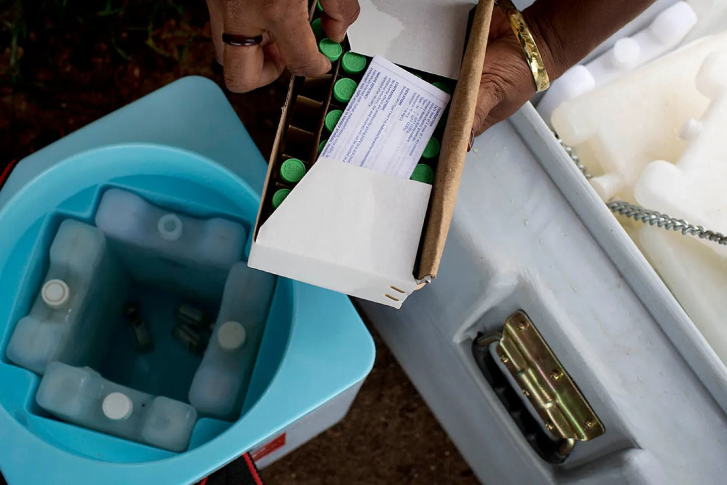 Polio vaccinators from the Papua New Guinea Department of Health put vaccines into a cold storage container, in March 2019. 
