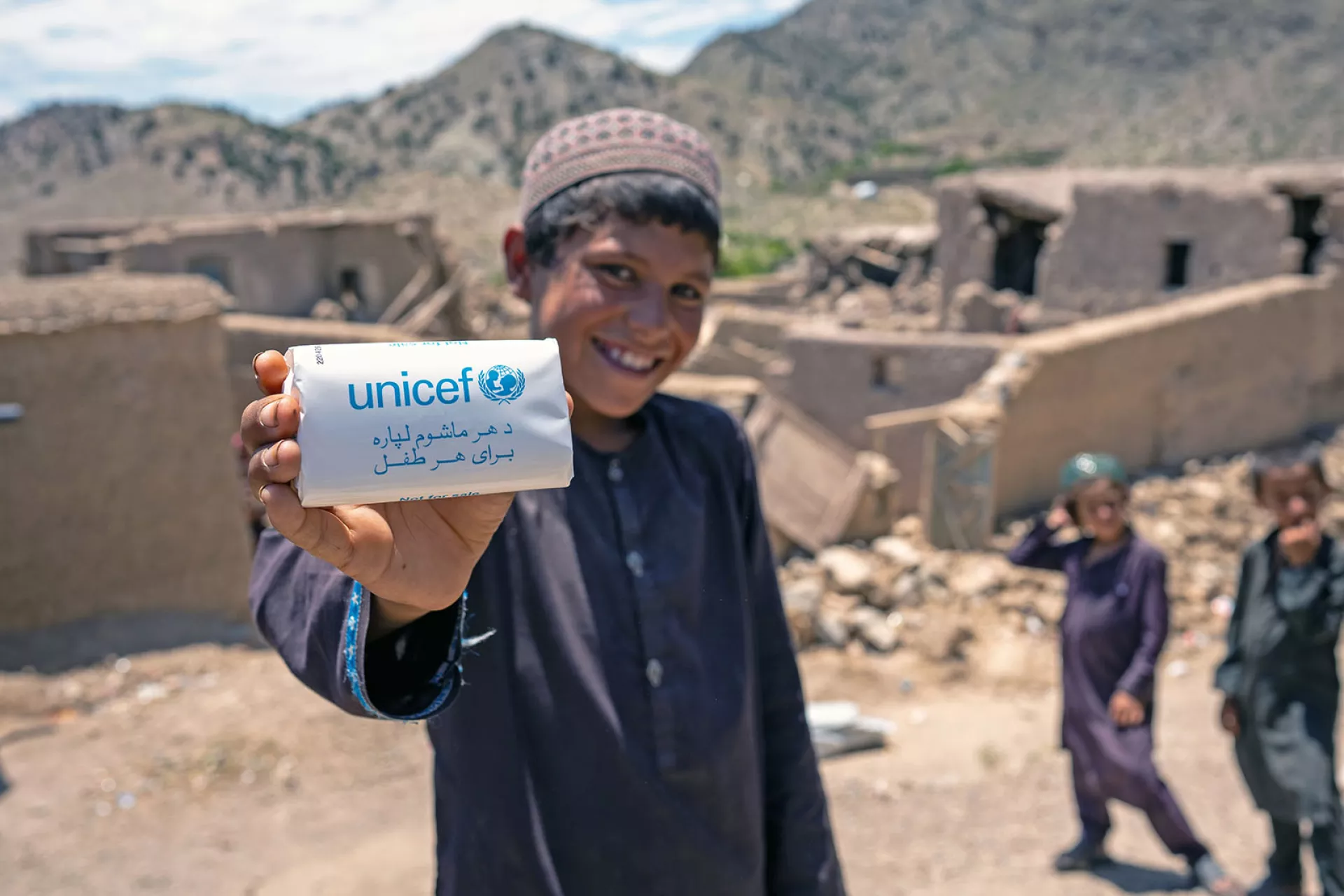 A boy holds a soap bar given to him at a UNICEF-supported distribution site in Barmal District, Paktika Province, Afghanistan.