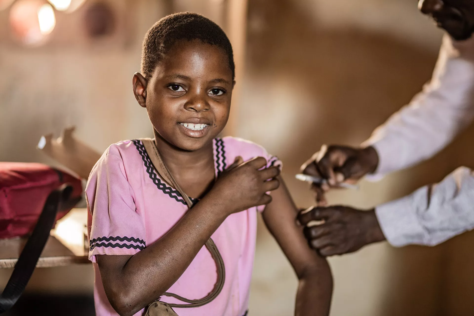 Eight years-old Grace Peterson receiving her typhoid vaccine