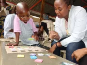 Healthcare staff playing with a child in hospital.