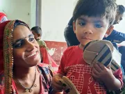 A mother playing with her son.