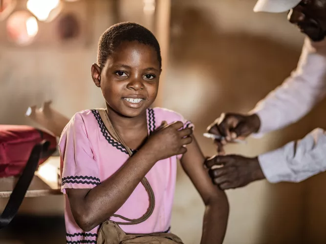 Eight years-old Grace Peterson receiving her typhoid vaccine