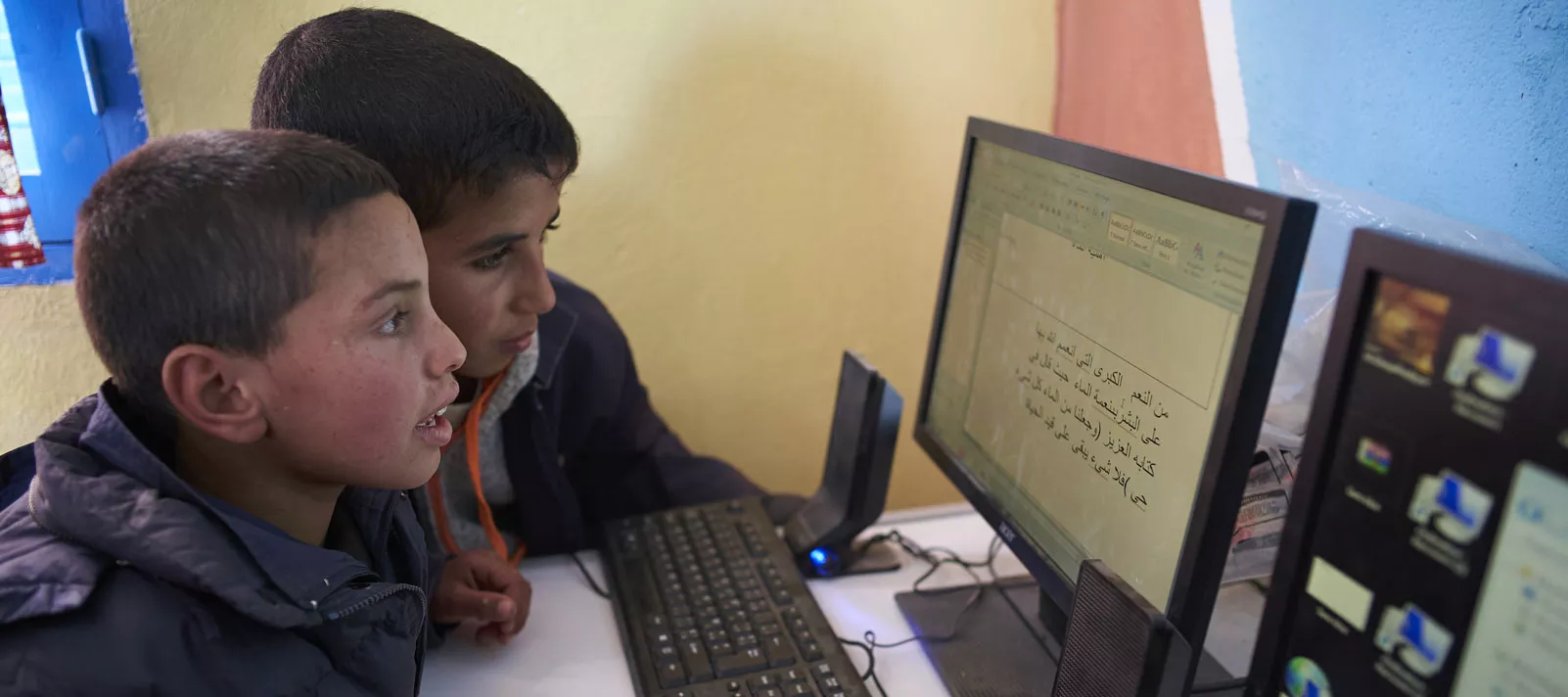 Children use computer in a library at Boufaroua Primary School on the outskirts of Sbeitla in Tunisia.