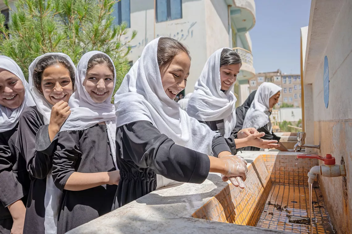 Eleven-year-old Sadaf Samadi washes her hands at the UNICEF-supported Fatah Girls School in Herat, Afghanistan.