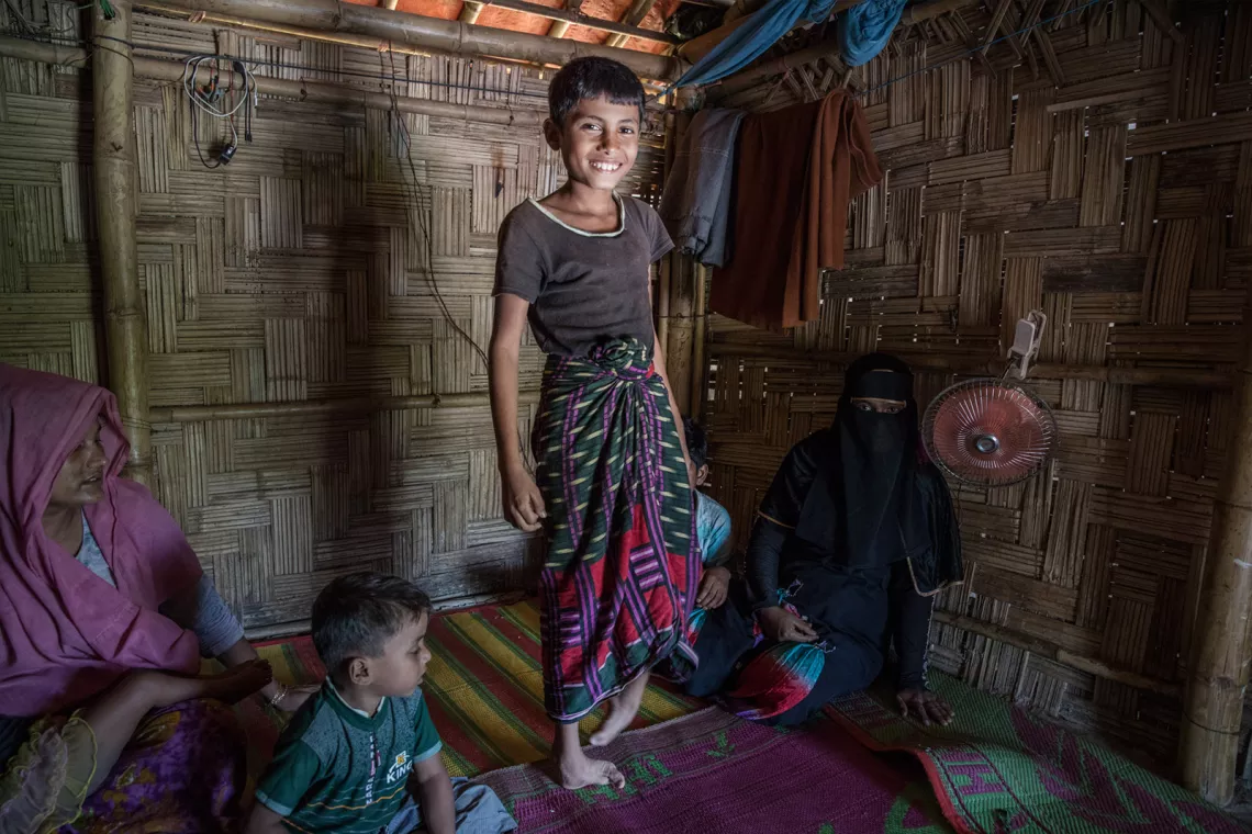 Sohel smiles in his home in Camp 16