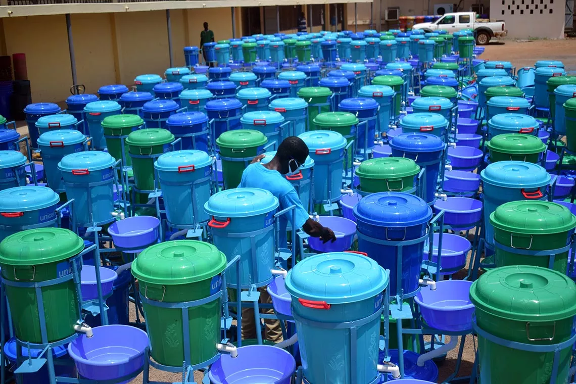 UNICEF Supply Officer, Pharaoh Semanhyia inspects handwashing facilities to be handed over to the Ministry of Health in Tamale in Ghana.