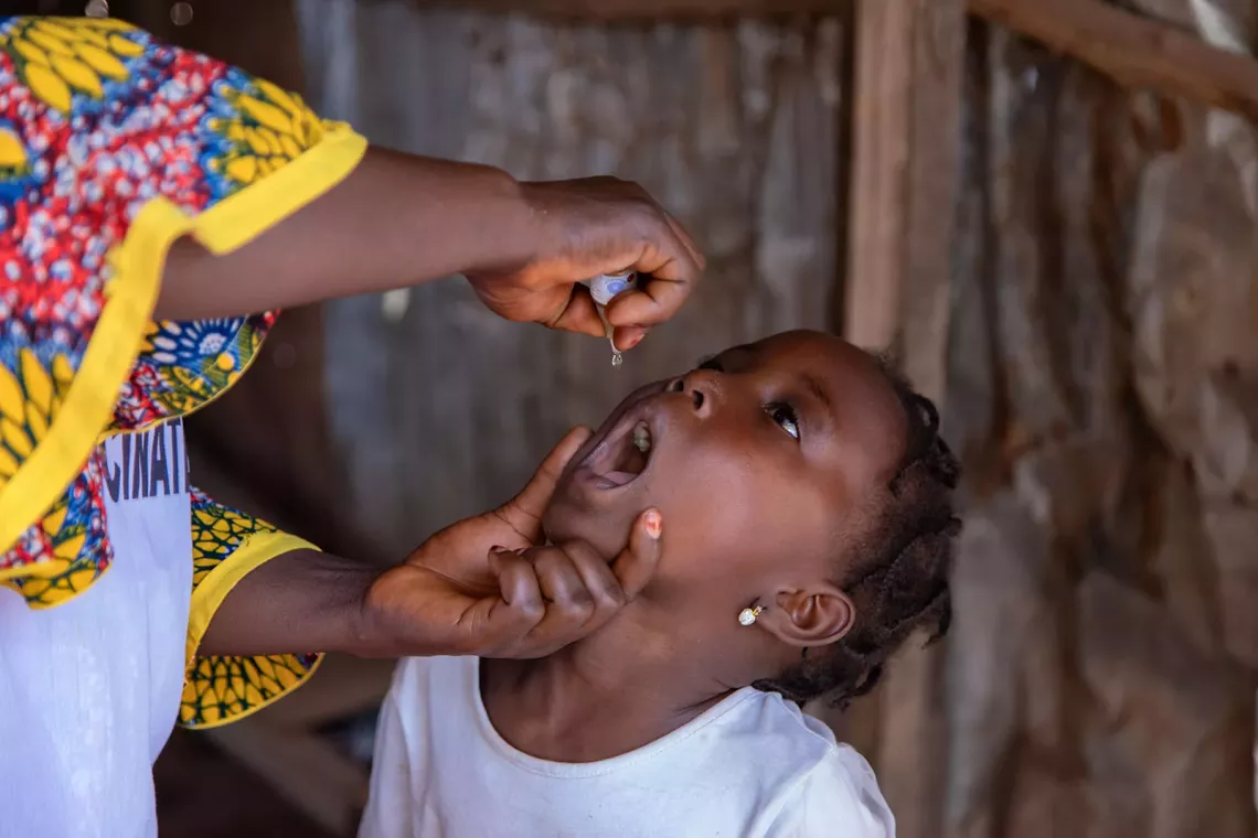 A child receiving the oral polio vaccine. 