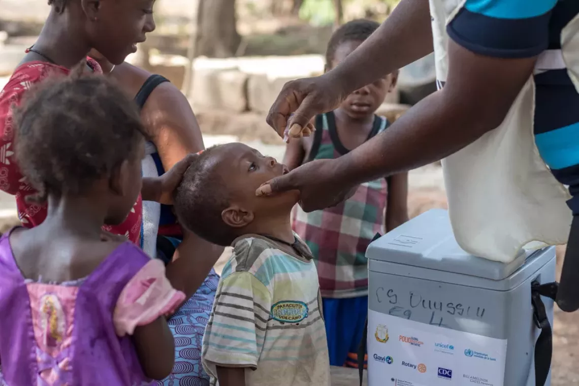 Child receives vaccine against polio.