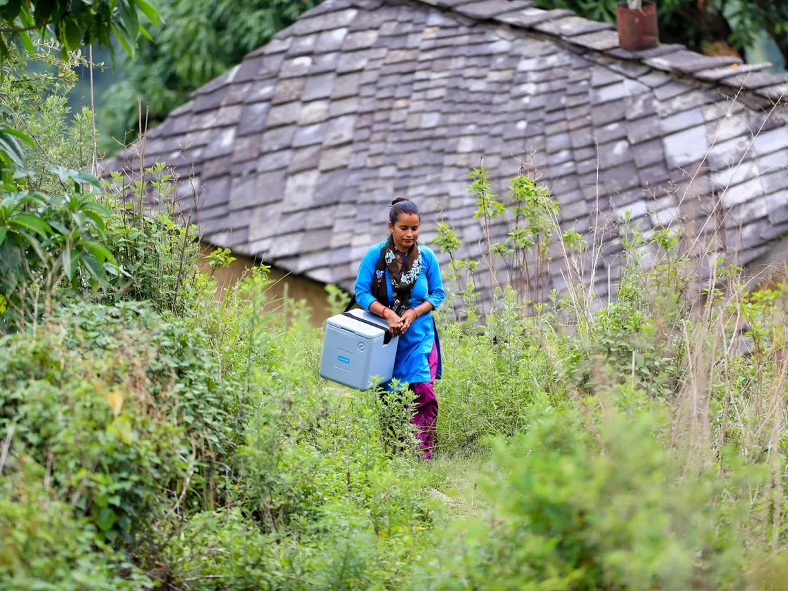 Health worker carrying vaccines