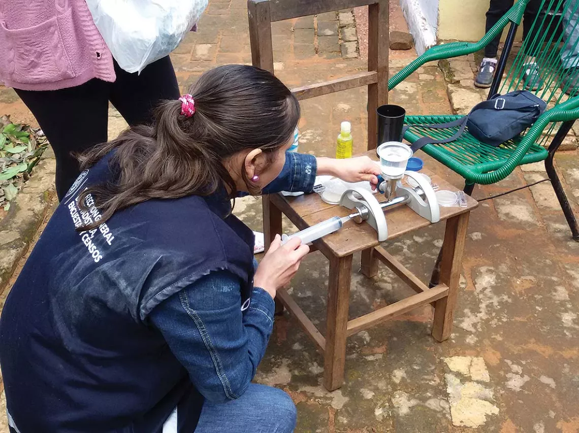 Conducting a water quality test in the field using current equipment options.