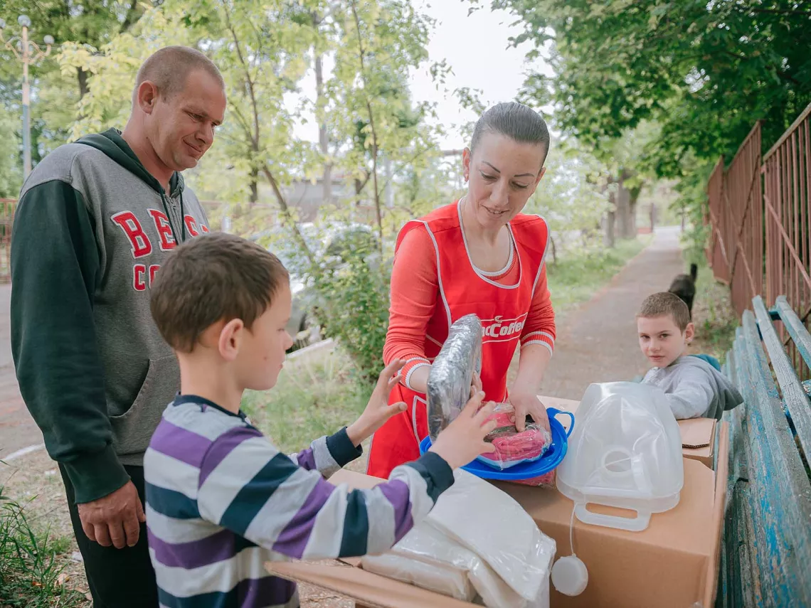 A family unpacks the WASH and Dignity Kit