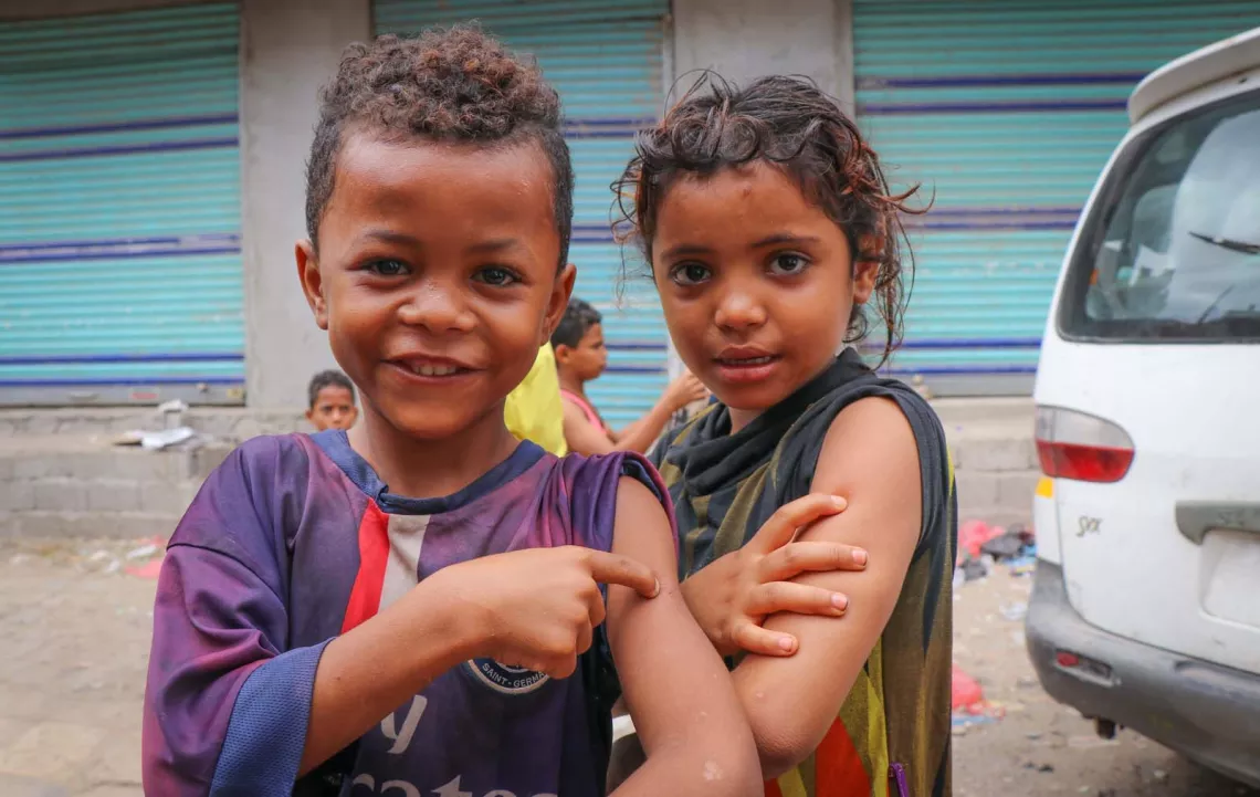 Children in Aden, Yemen show off the spots on their arms where they were vaccinated during a mobile Measles and Rubella vaccination campaign backed by UNICEF, in February 2019. 