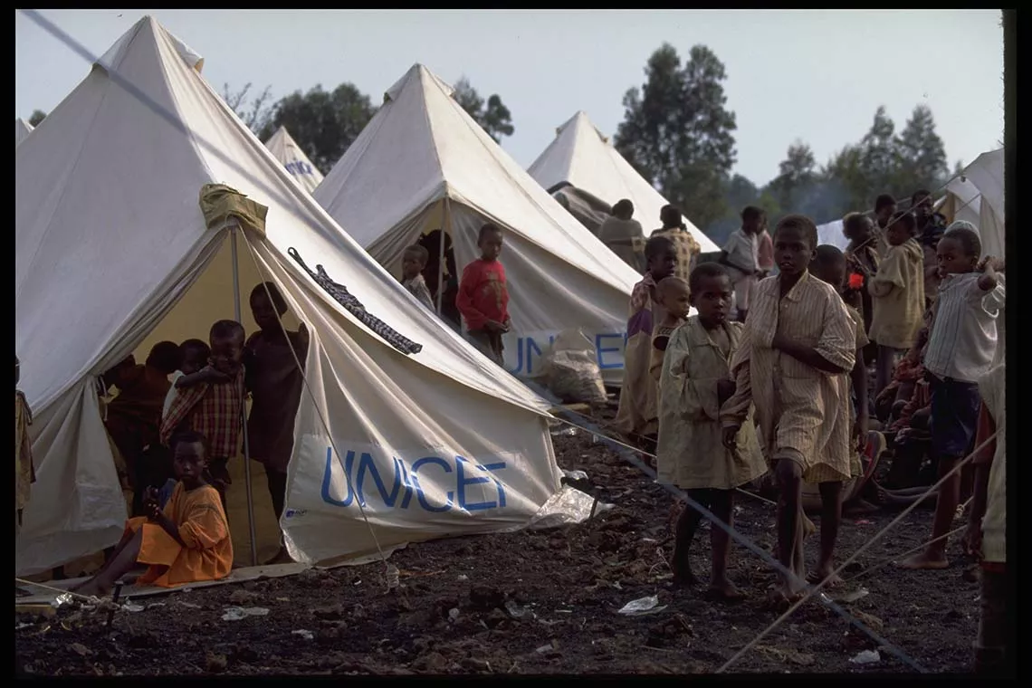 Rwandan refugee children stand in and around tents supplied by UNICEF Somalia, in the Ndosho camp for unaccompanied children near the town of Goma.
