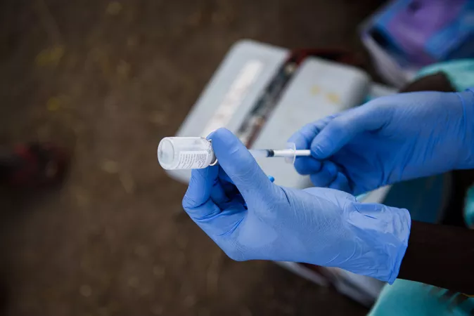 A health volunteer fills a syringe with a dose of a vaccine in South Sudan, in May 2017.