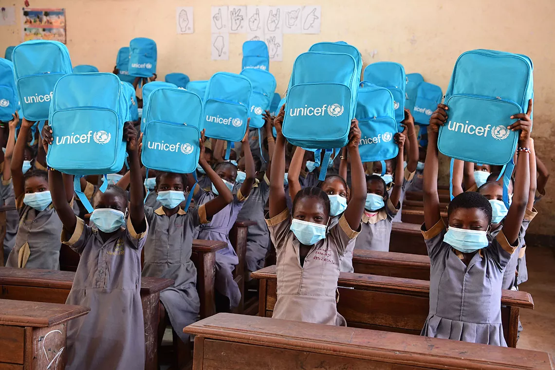 Children celebrate receiving their new backpacks in a UNICEF-supported public school in Founangu&eacute;, Cameroon.