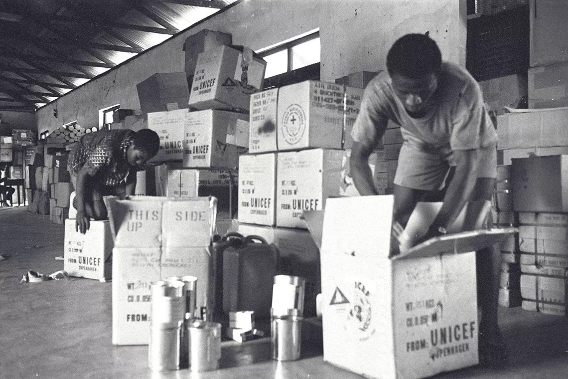 In 1969, local staff pack UNICEF medical supplies at the World Council of Churches central store at Ubulu in the Biafran region, in Nigeria. 