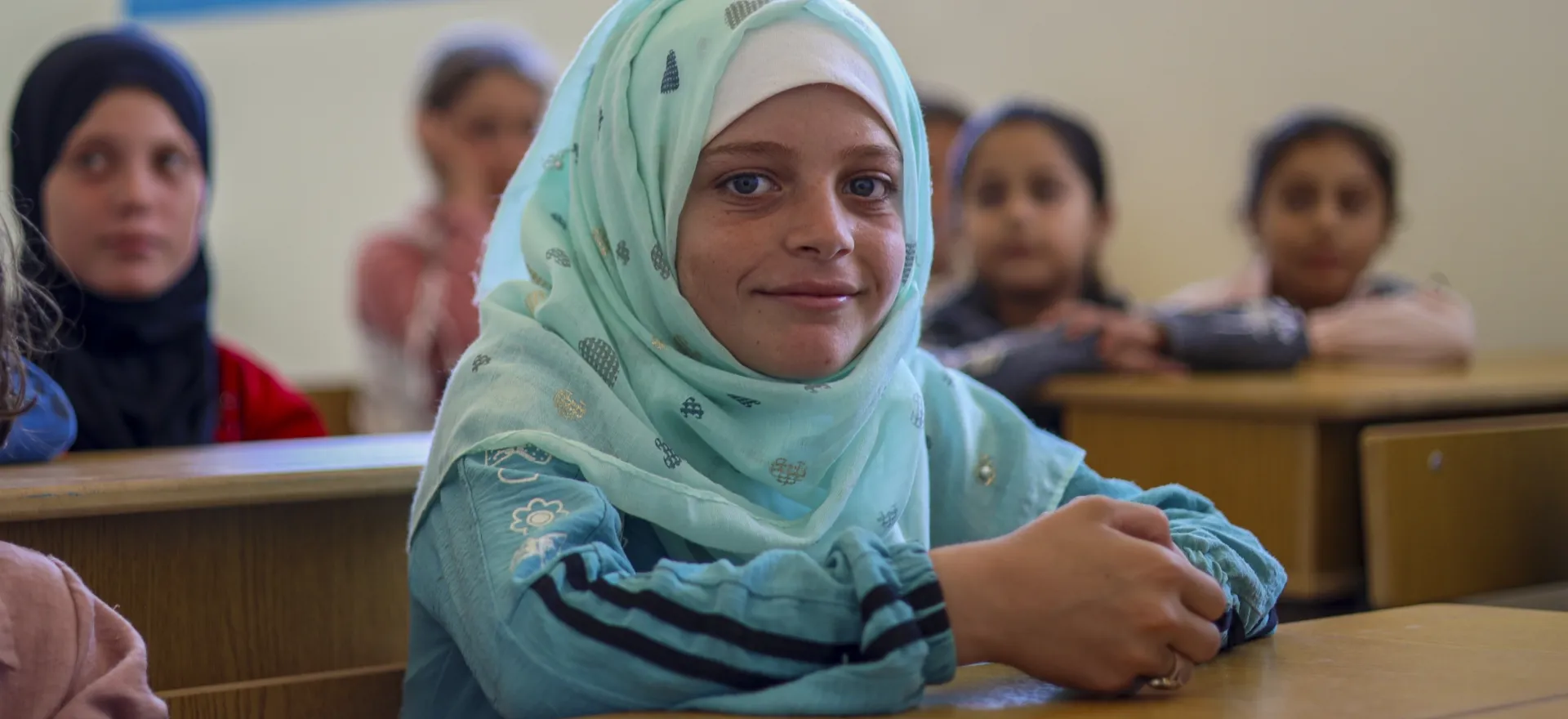 Samar, 11, sits in her remedial classroom, in the UNICEF- rehabilitated Mazraet Alhota school, in rural Aleppo.