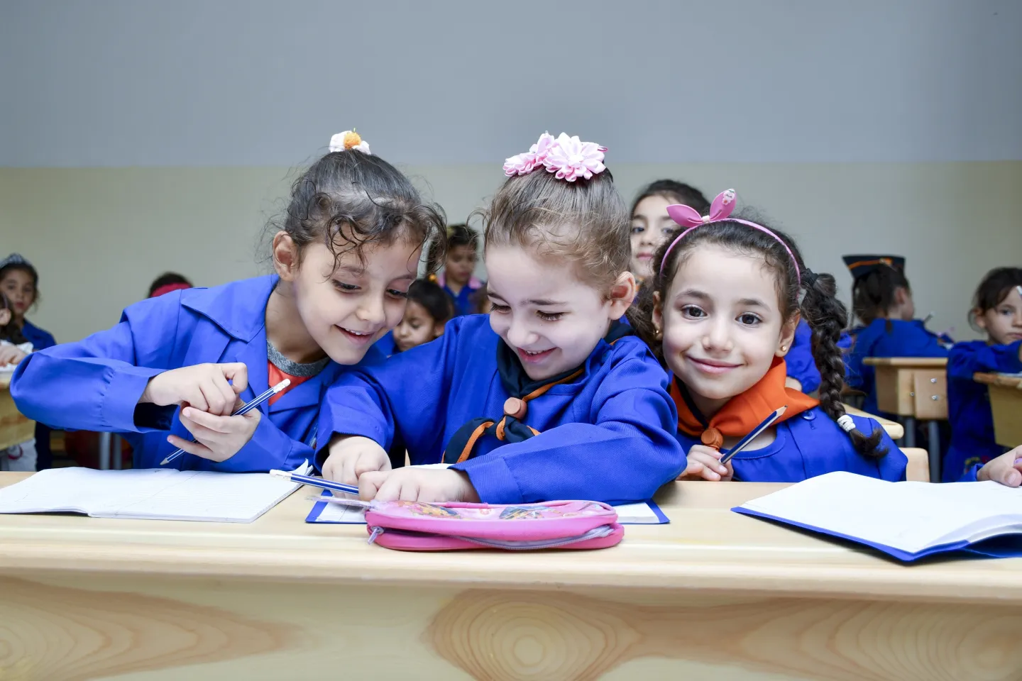 (From right to left) Aya, 6, Arwa, 6, and Loulya, 6, sit next to each other during a math class in a UNICEF-rehabilitated school in Hazzeh village, Rural Damascus.