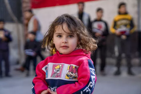 Hadeel, 2, participates in a recreational activity provided by UNICEF-supported volunteers in Abdul Muttaleb Al Qad School, on 15 February 2023.