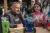 UNICEF Syria Ambassador Qays Sheikh Najib listens as a young girl explains her robotics invention during the Blue Seeds event at Tishreen Park in Damascus.