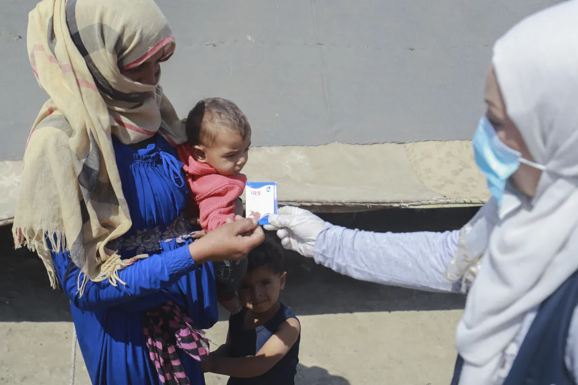 volunteer-distributing-oral-rehydration-salts
