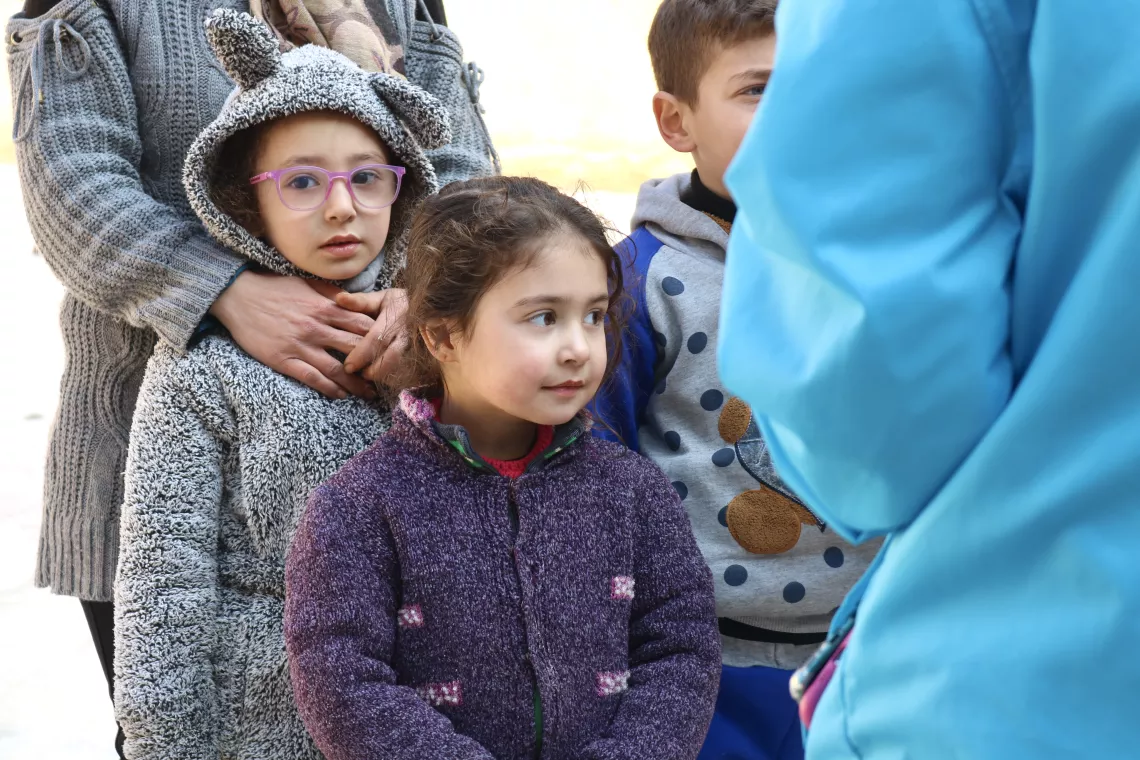 Haneen, 5, and Alma, 3 1/2, stand together at a school-turned-shelter in Al-zebdiyeh neighbourhood, Aleppo city.
